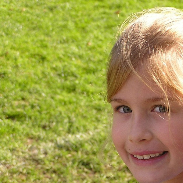 team smiling outdoors